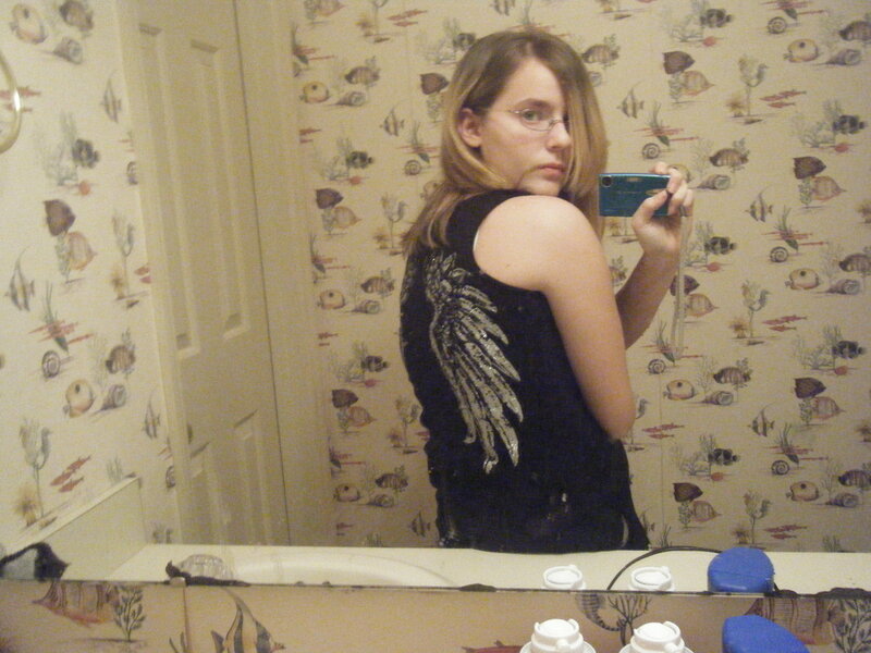 woman taking mirror selfie
