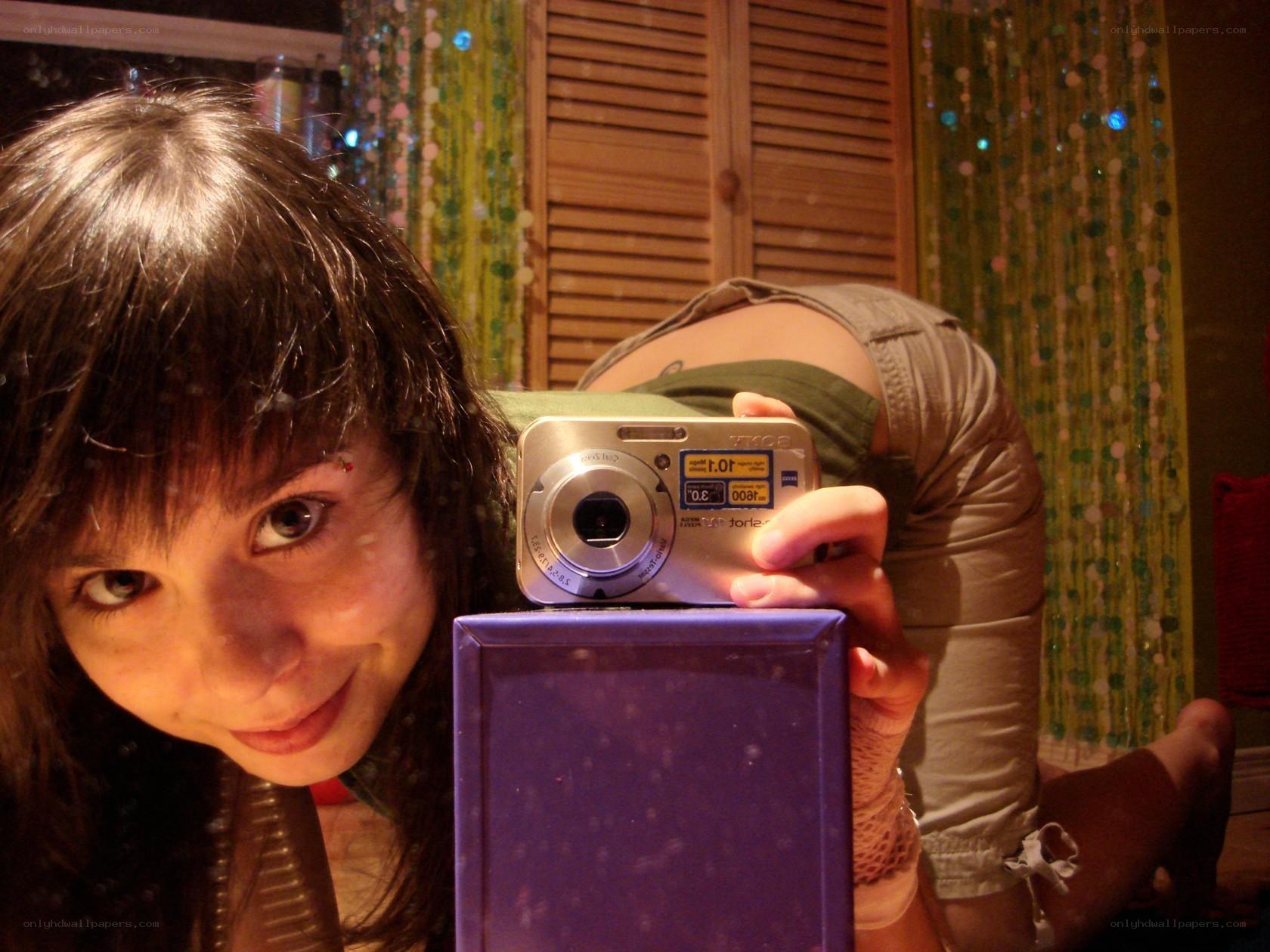 woman taking mirror selfie