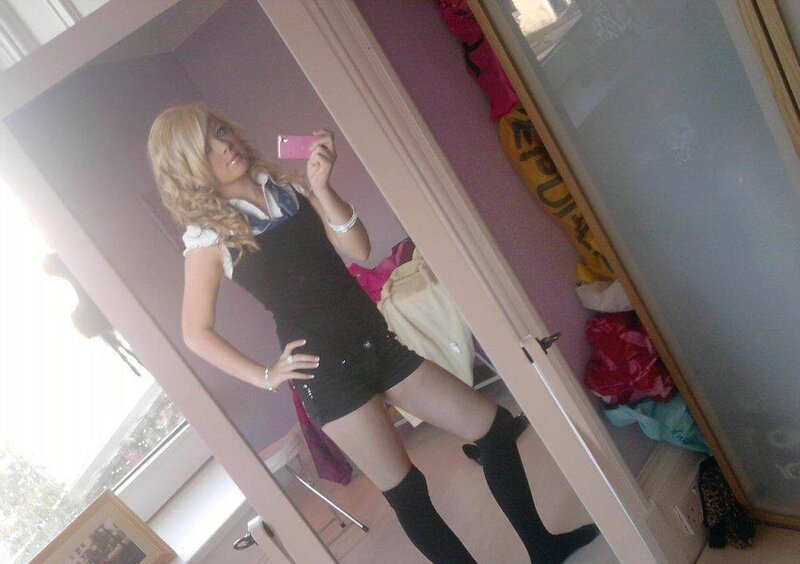 woman taking mirror selfie
