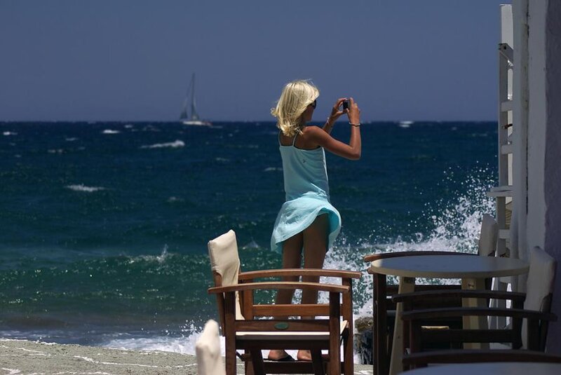 Woman Taking Photo at Beach — Blue