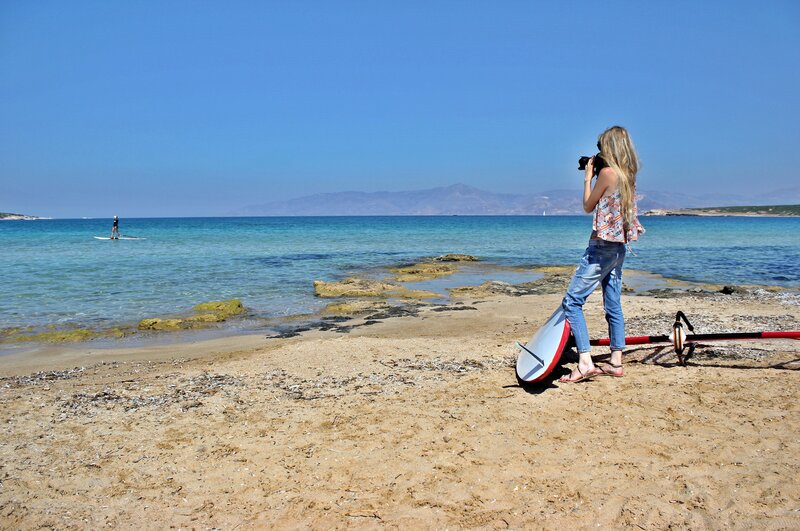 Woman Taking Photo on Beach — Blue