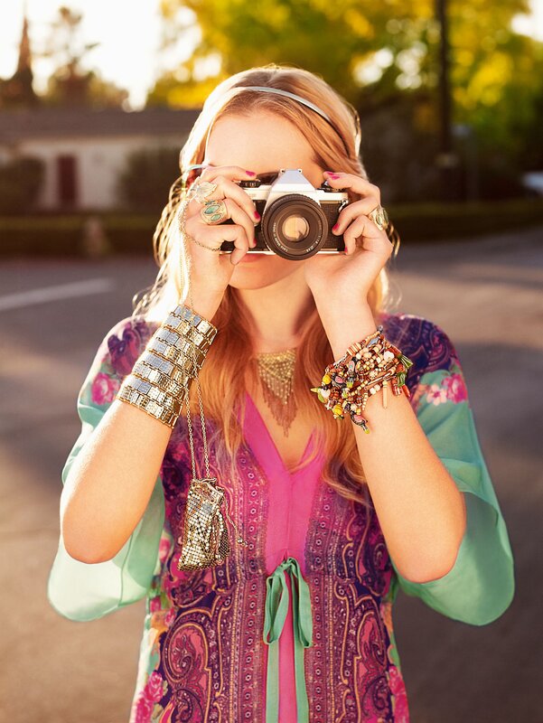 woman taking photo with vintage camera