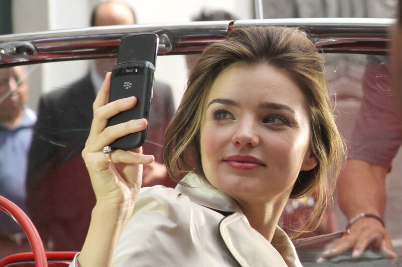 woman taking selfie in car