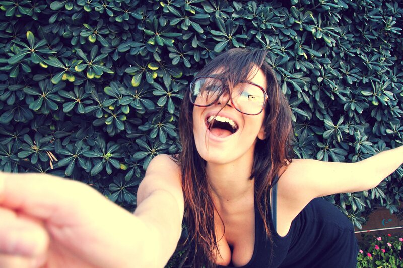 woman taking selfie with glasses