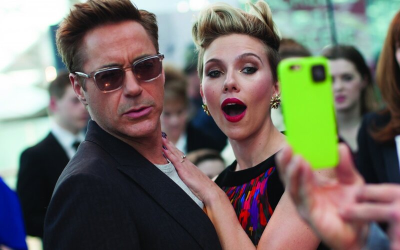 Woman Taking Selfie with Man