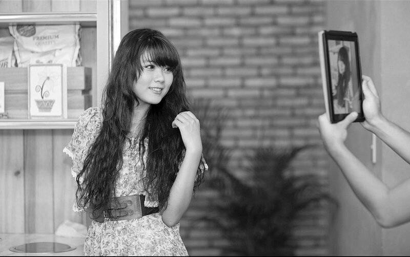 woman taking selfie with tablet