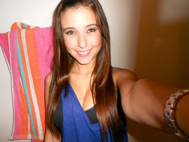 woman taking selfie with towel