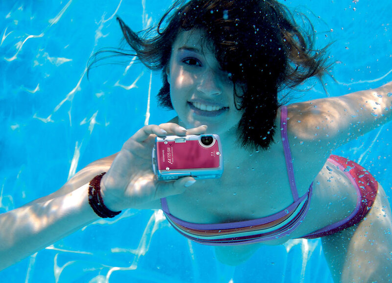 woman taking underwater photo