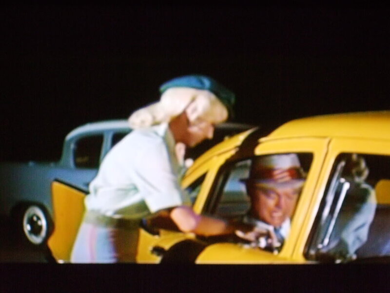 Woman Talking to Man in Car