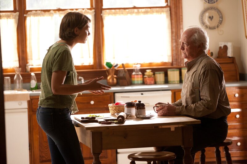 woman talking to man in kitchen