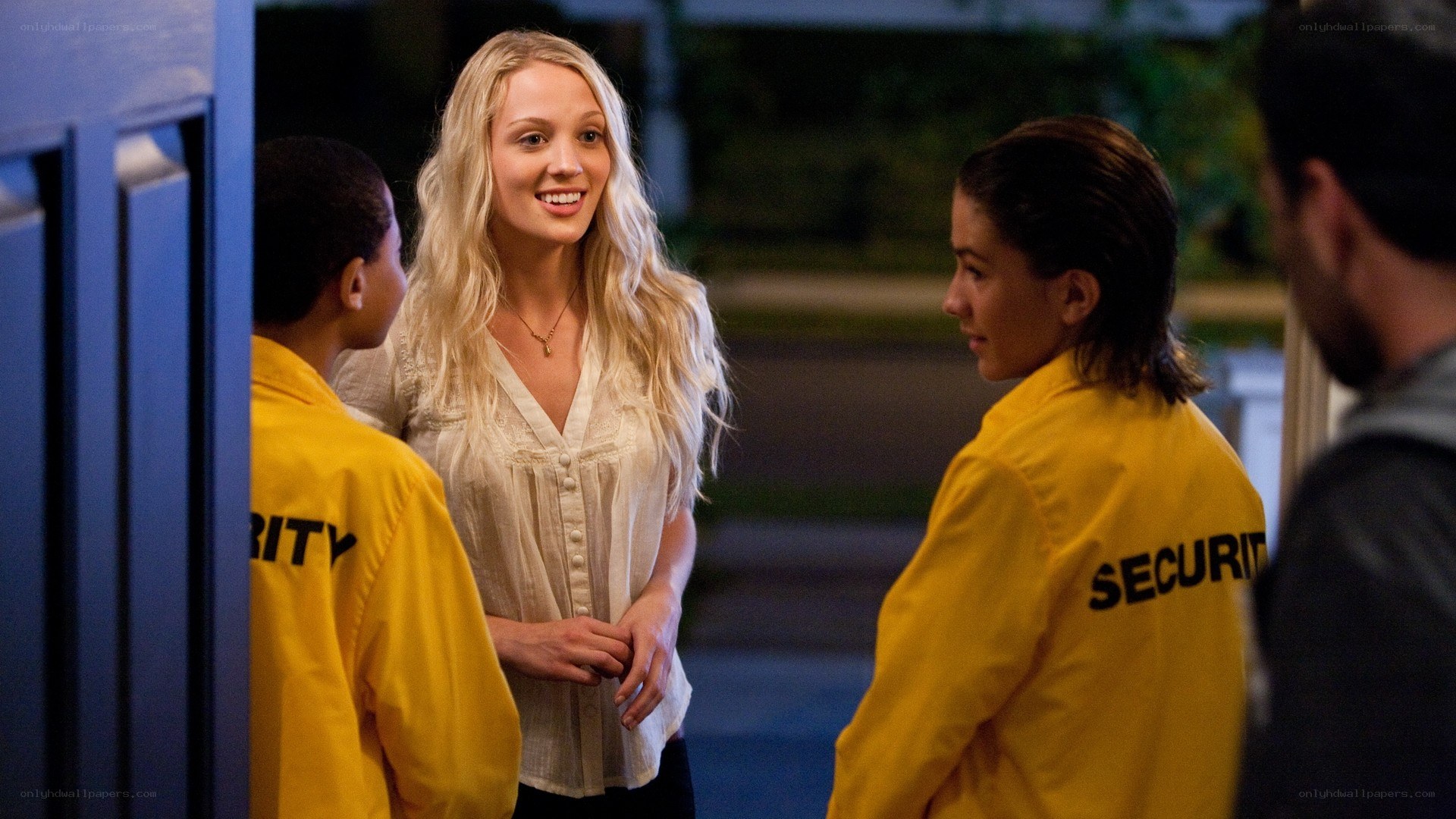 Woman talking to security guards