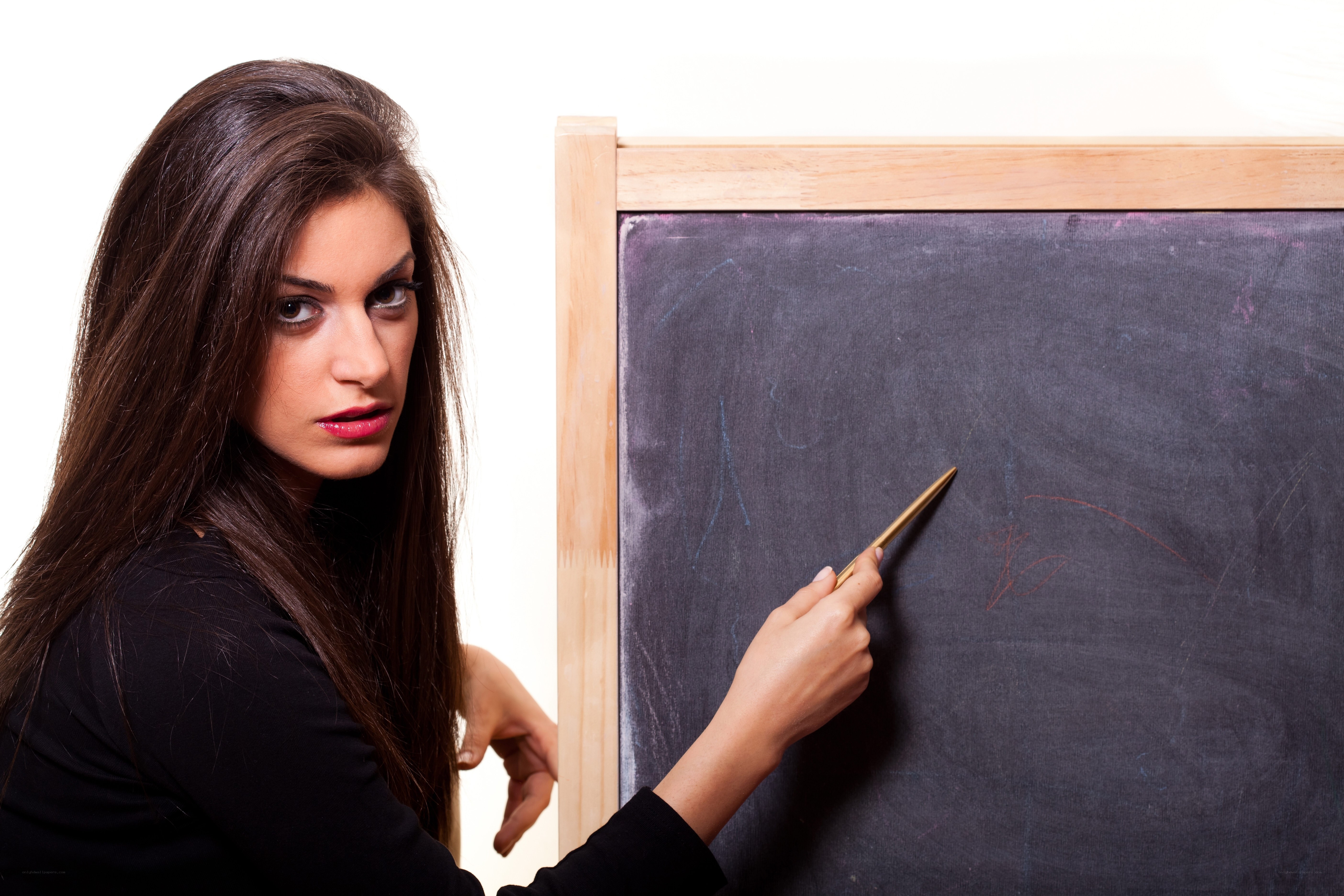 woman teaching at blackboard