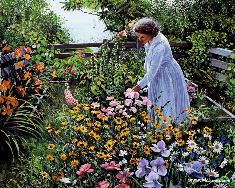 Woman tending a flower garden