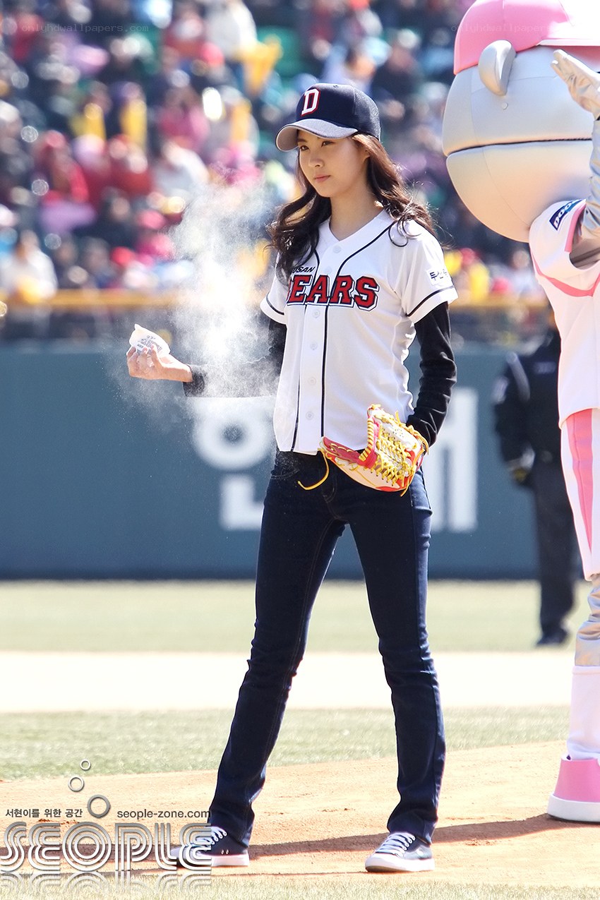 woman throwing first pitch