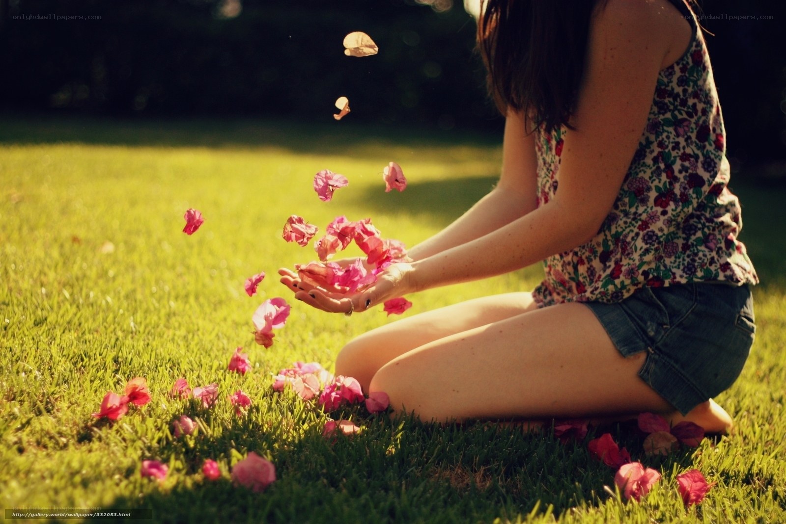 Woman throwing flower petals