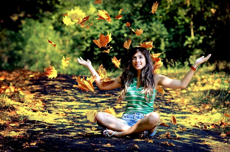 Woman Throwing Leaves
