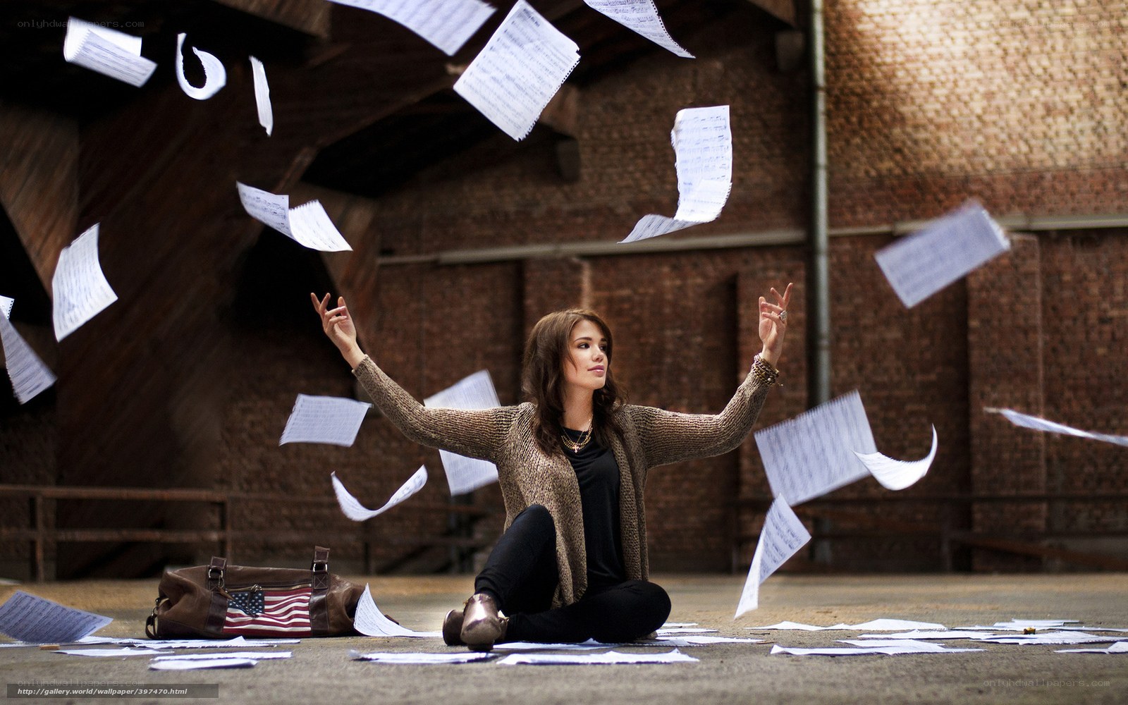 woman throwing papers in air