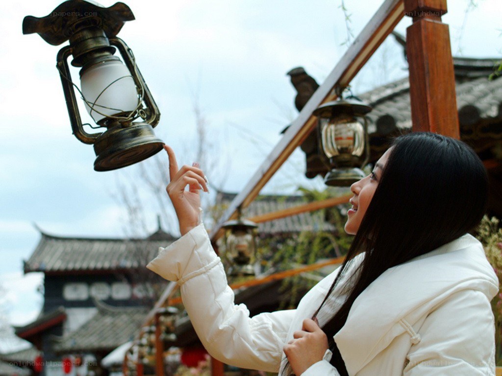 Woman touching a lantern