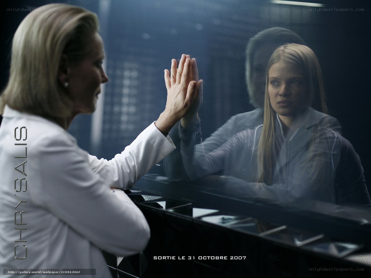 woman touching glass mirror