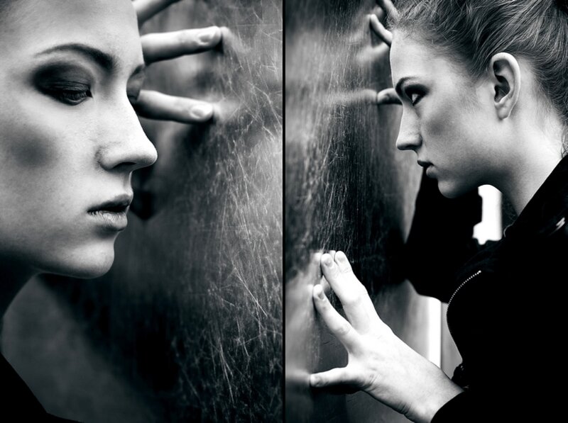 woman touching glass wall