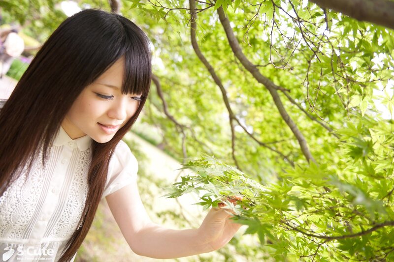 Woman touching green leaves