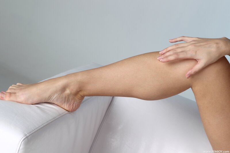 woman touching her leg