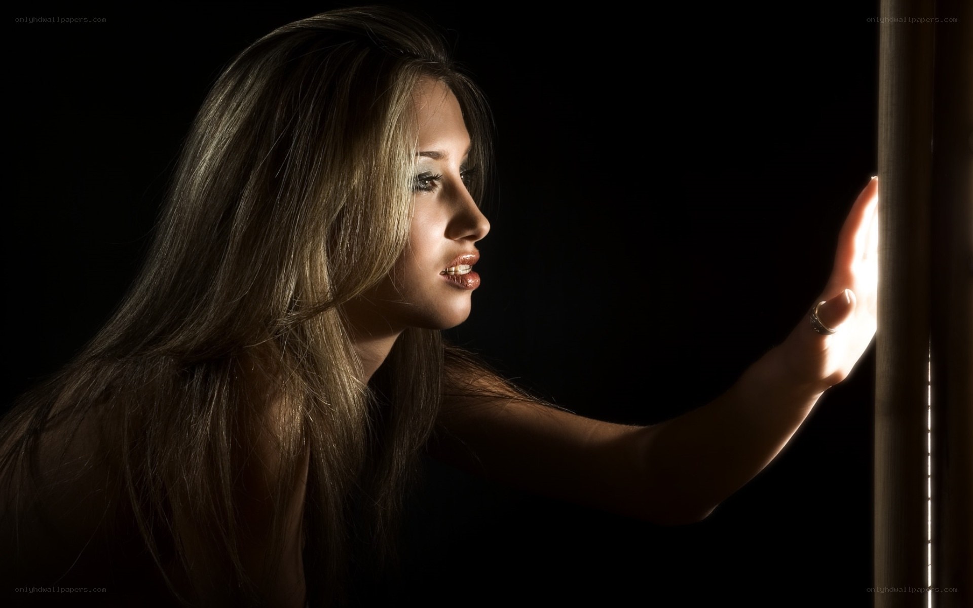 woman touching light source