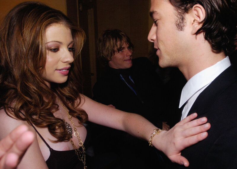 woman touching man's shoulder