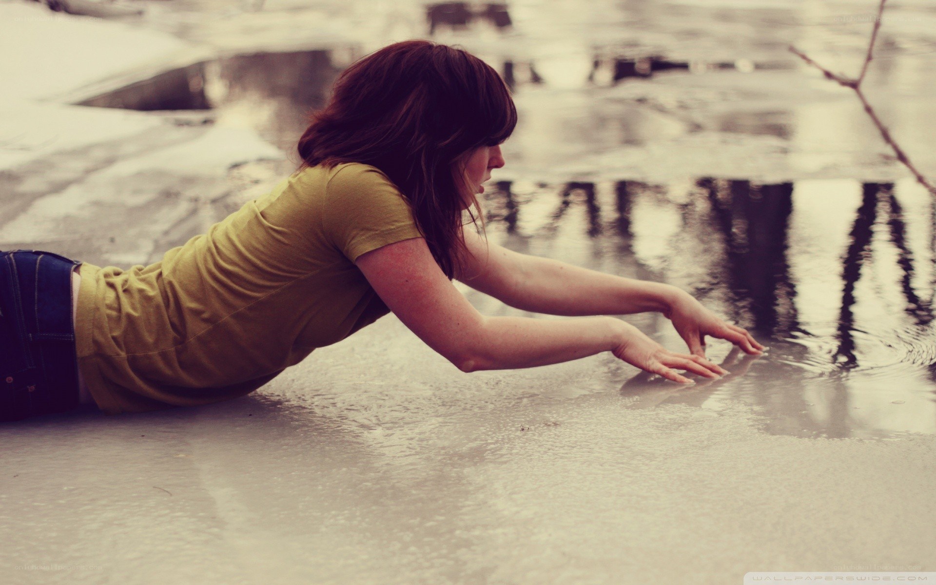 woman touching water surface