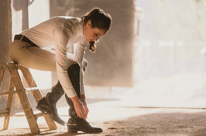 Woman Tying Boots — Brown