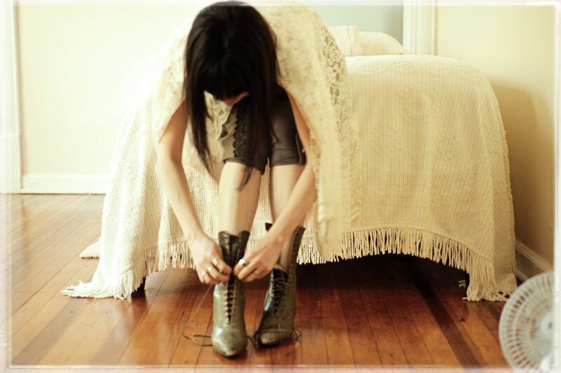 Woman Tying Boots