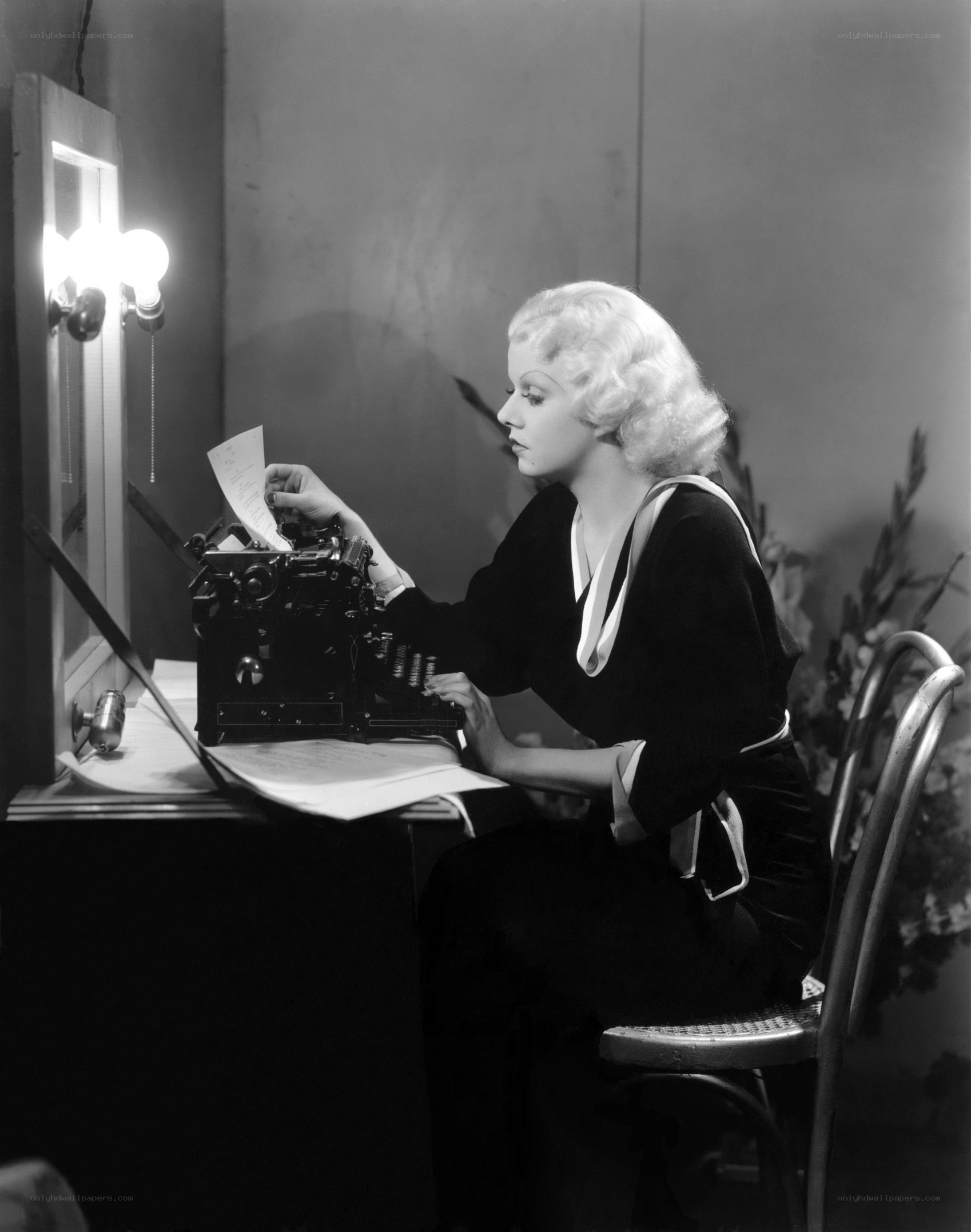 woman typing at a desk