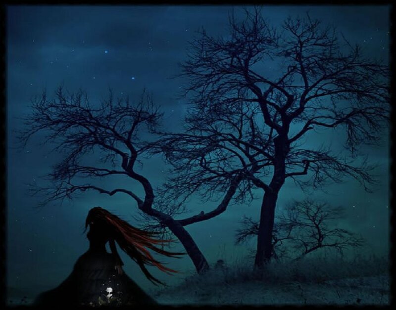woman under a bare tree at night