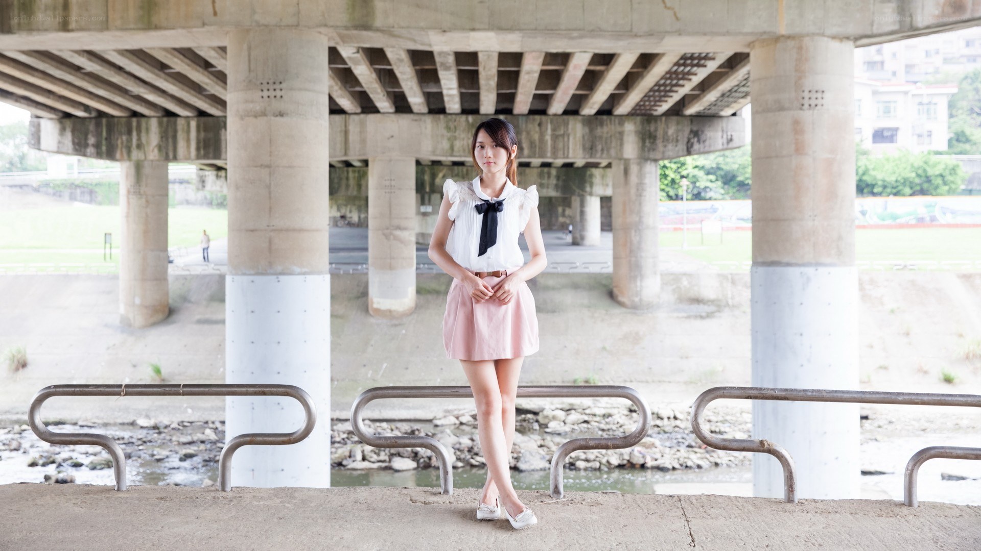 Woman under a bridge