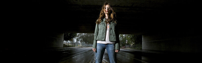 woman under a bridge