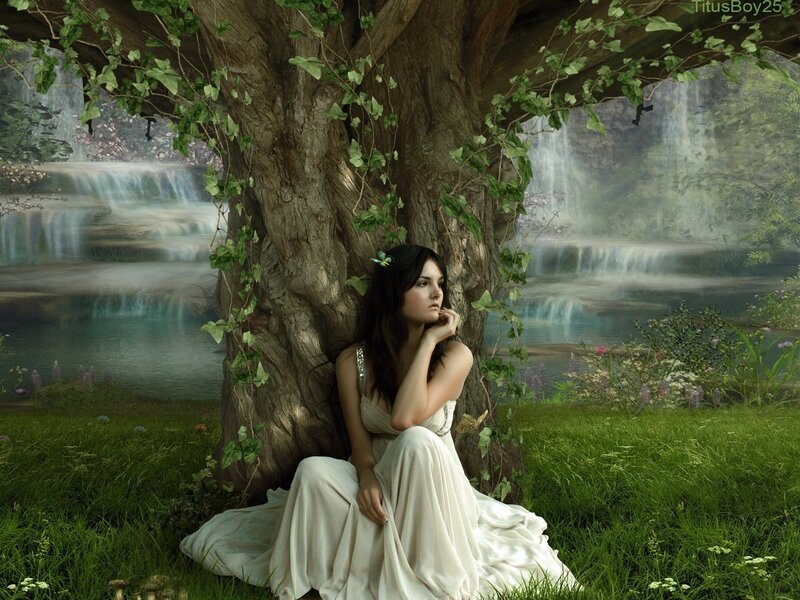 Woman under a tree in a fantasy landscape