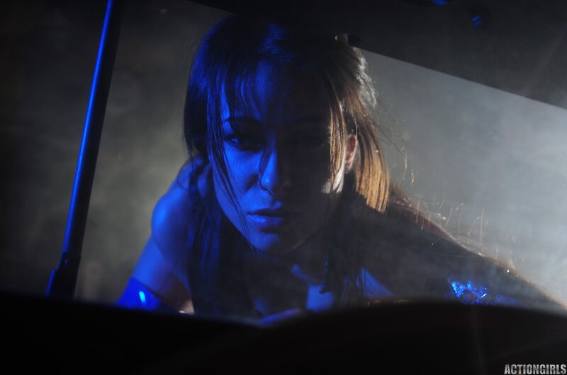 woman under blue light in car