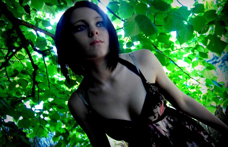 woman under green leaves