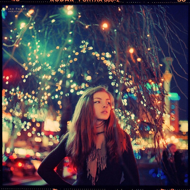 woman under lights at night