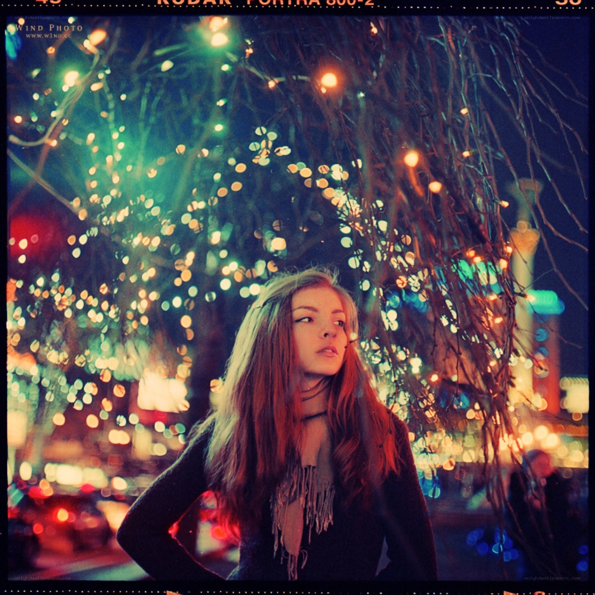 woman under lights at night