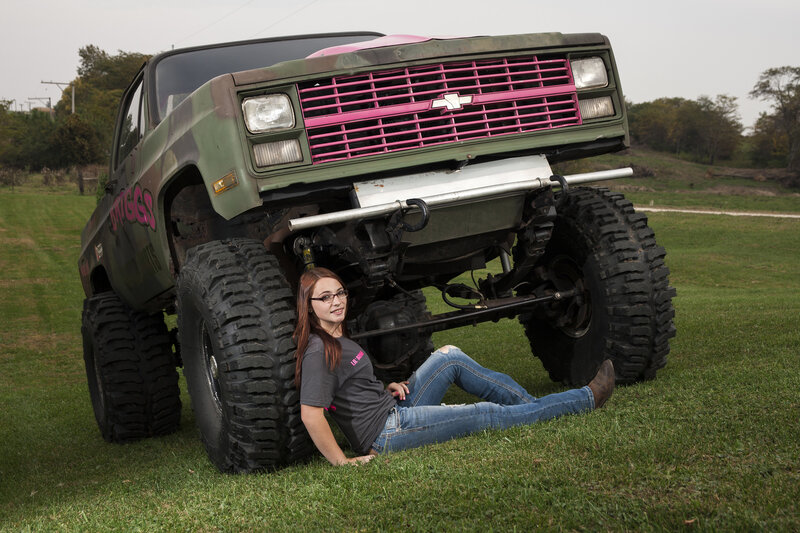 Woman under Monster Truck