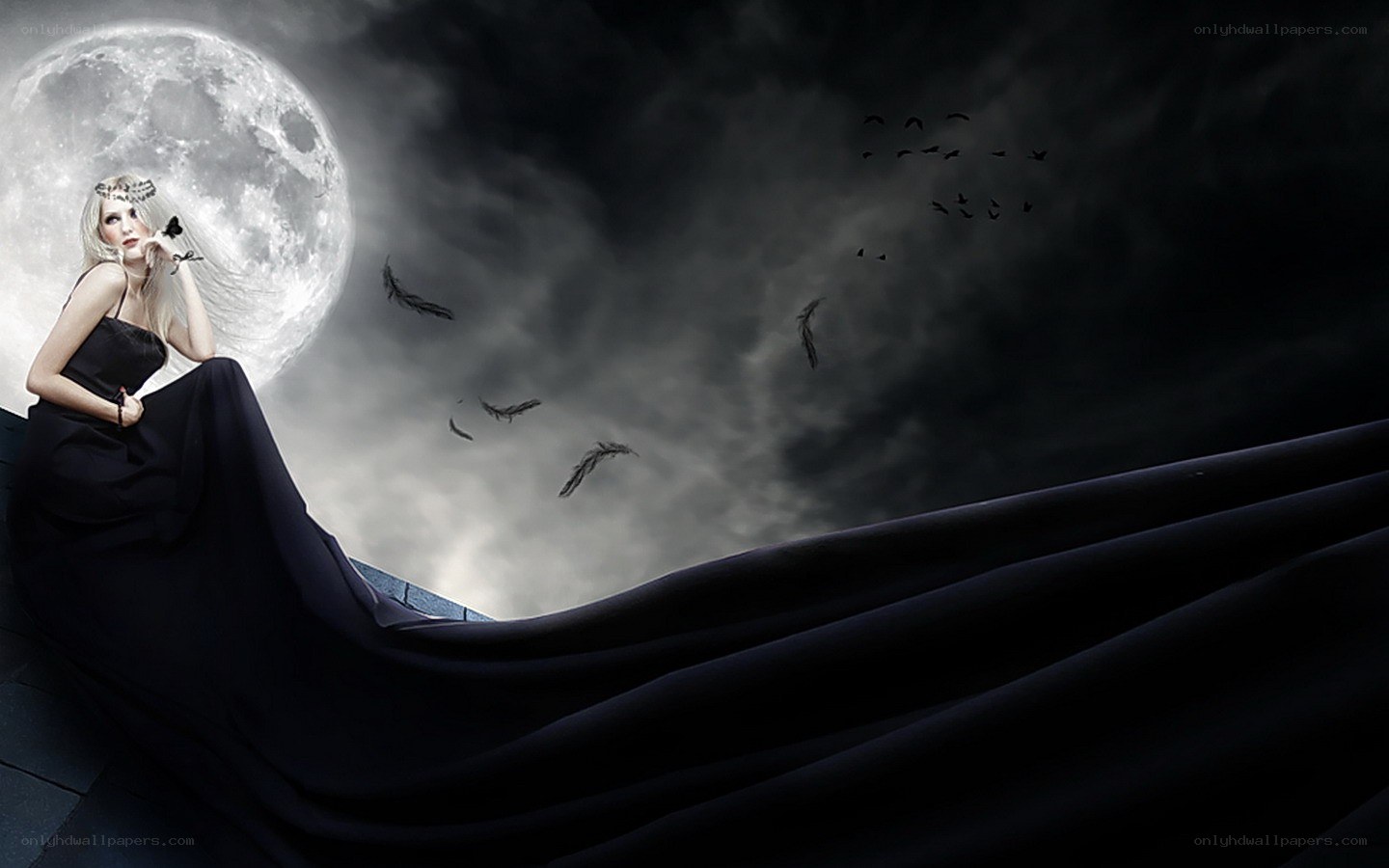 woman under moonlight with feathers