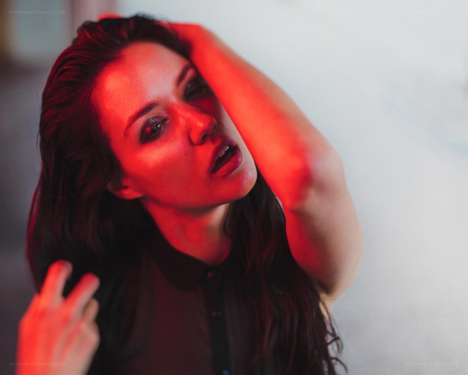 woman under red light