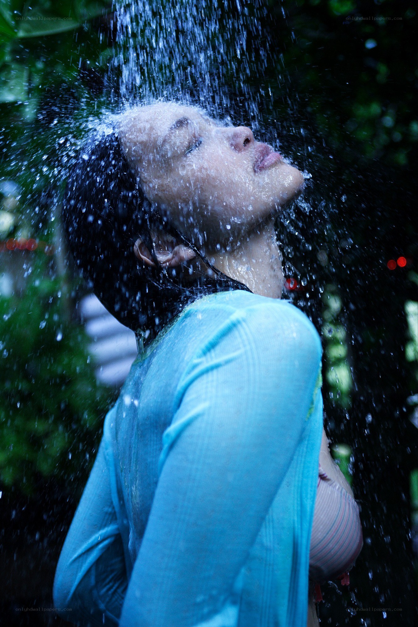woman under shower spray