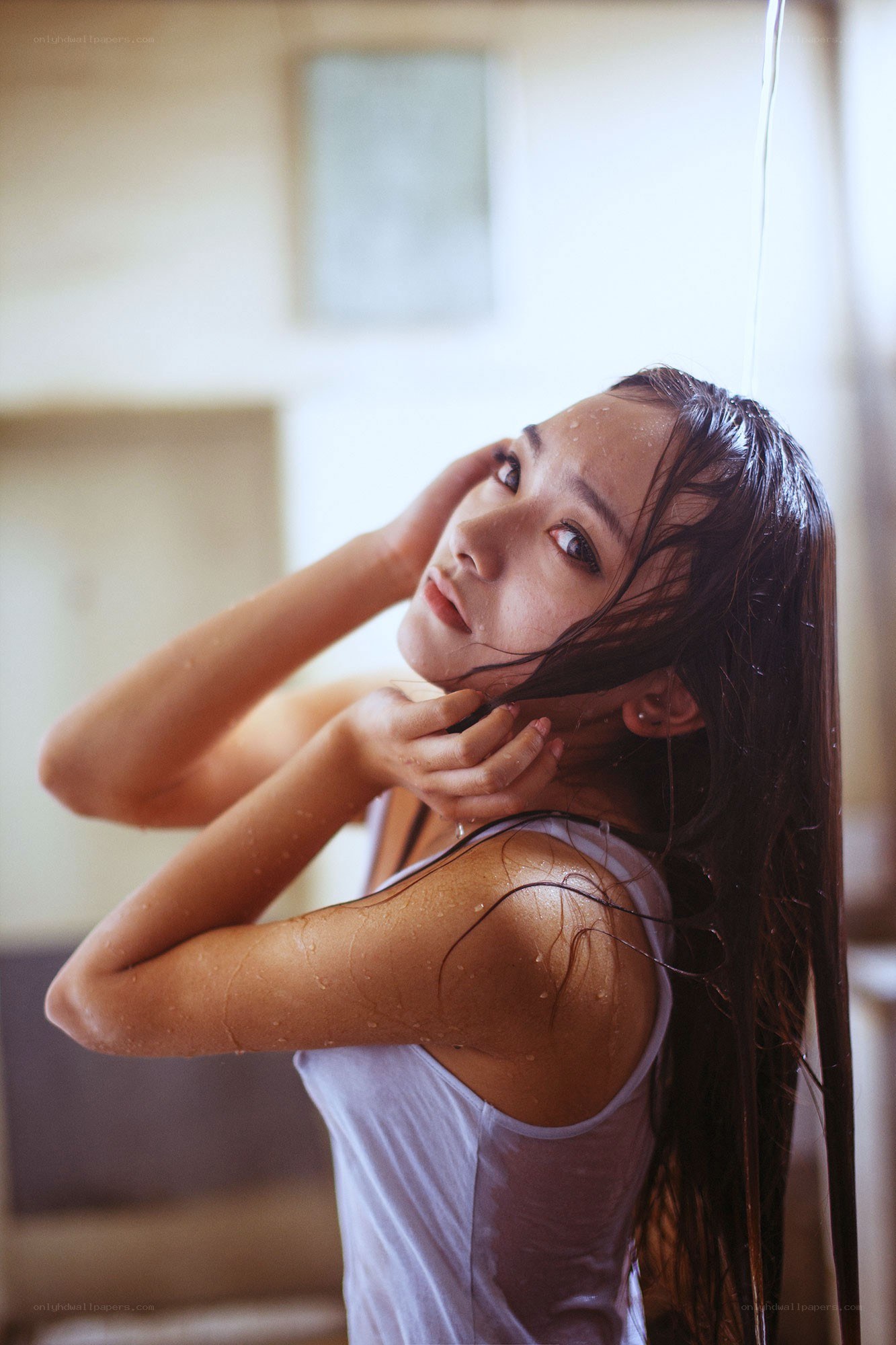 woman under shower stream