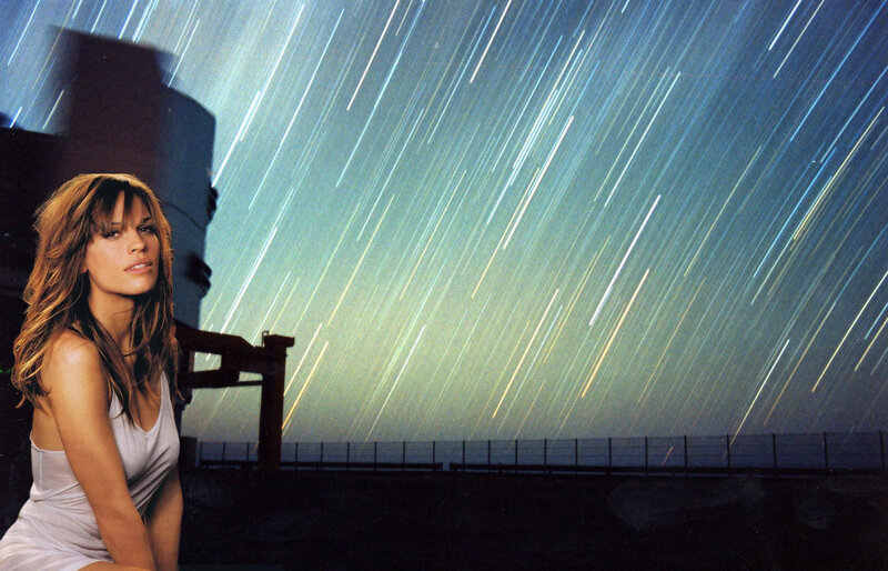 woman under star trails