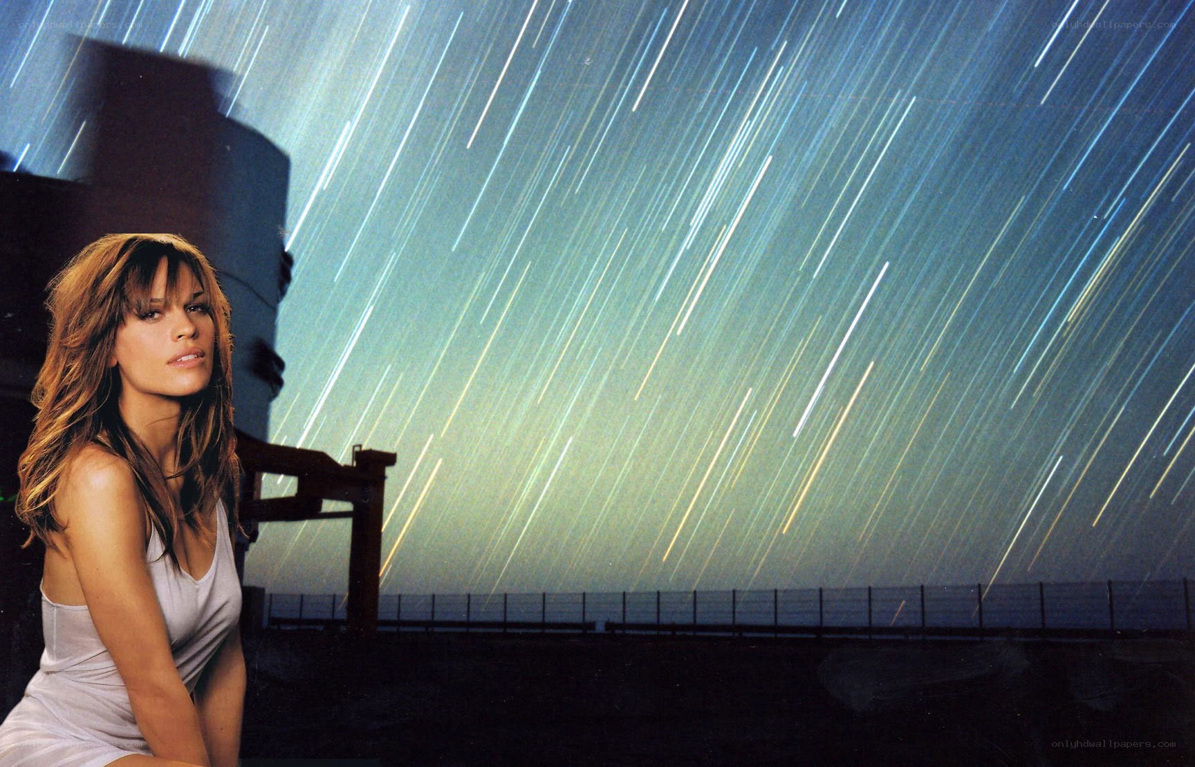 woman under star trails