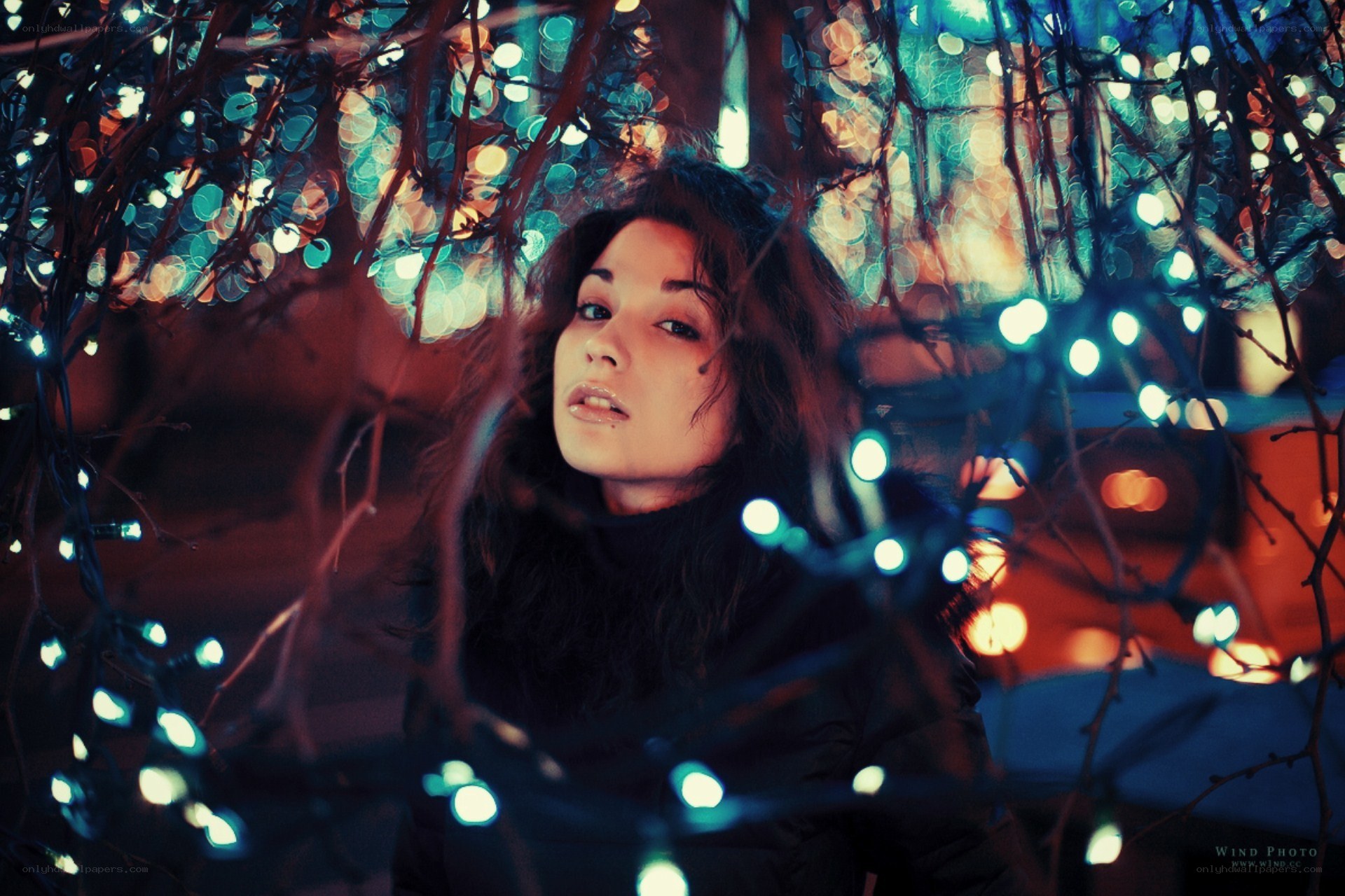 woman under string lights