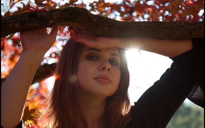 woman under tree branch