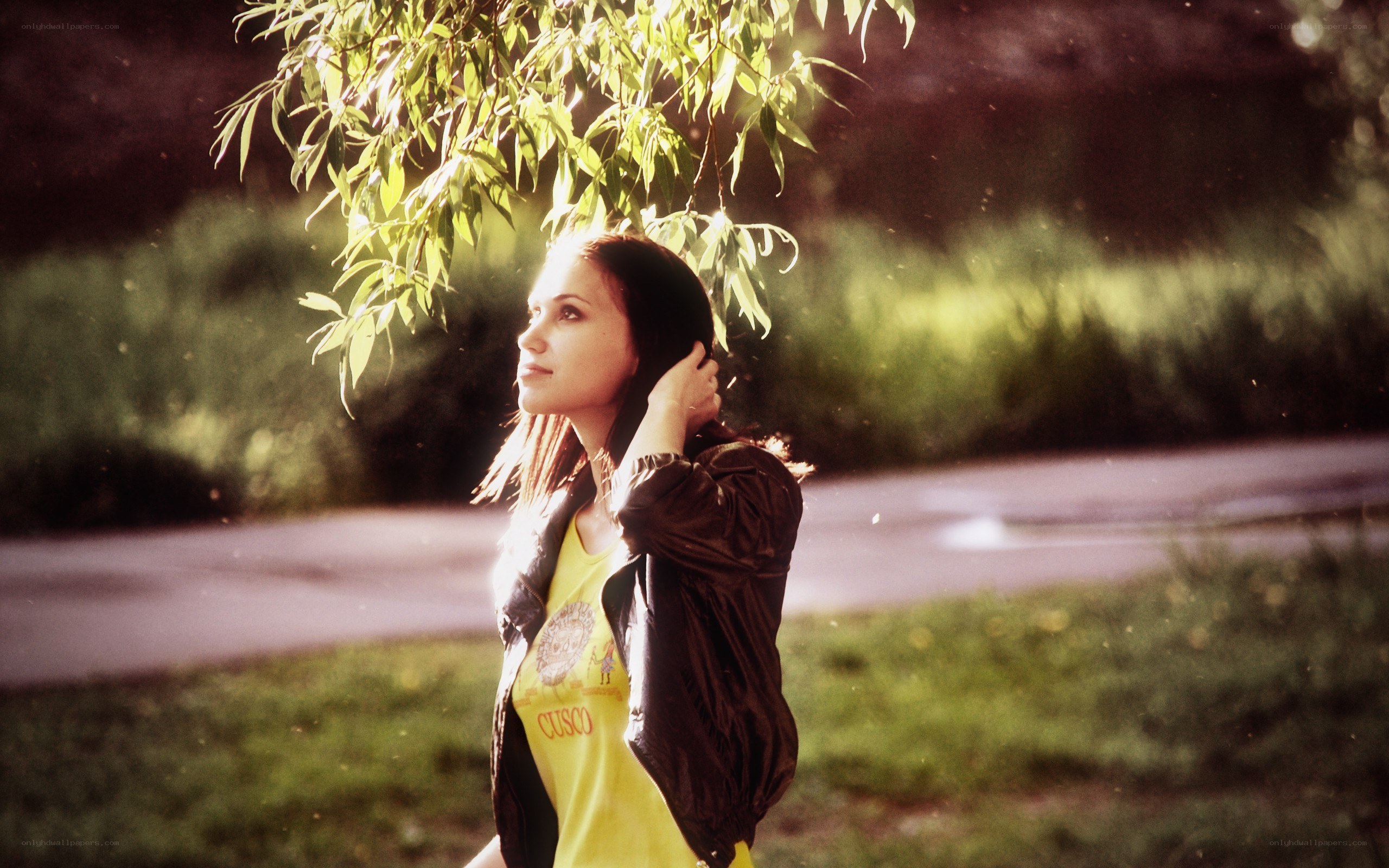 woman under tree in sunlight